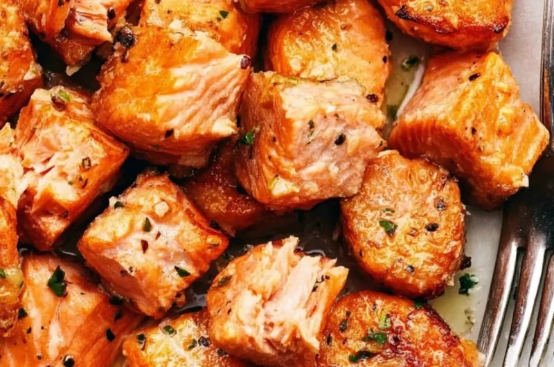 Air fryer salmon bites with lemon garlic butter sauce on a plate