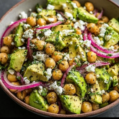Healthy Chickpea Feta Avocado Salad with fresh vegetables and herbs