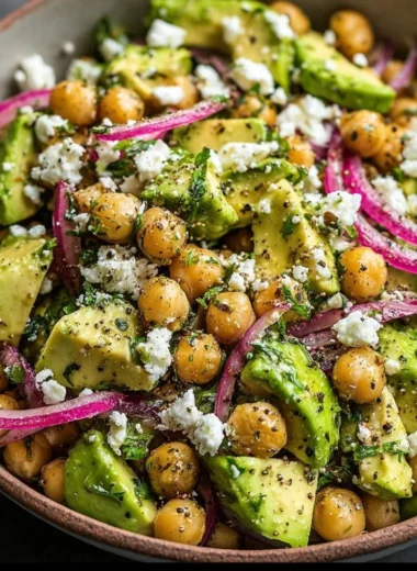 Healthy Chickpea Feta Avocado Salad with fresh vegetables and herbs