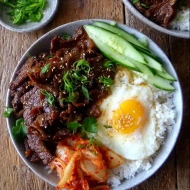 Delicious easy beef bulgogi bowl garnished with vegetables and sesame seeds