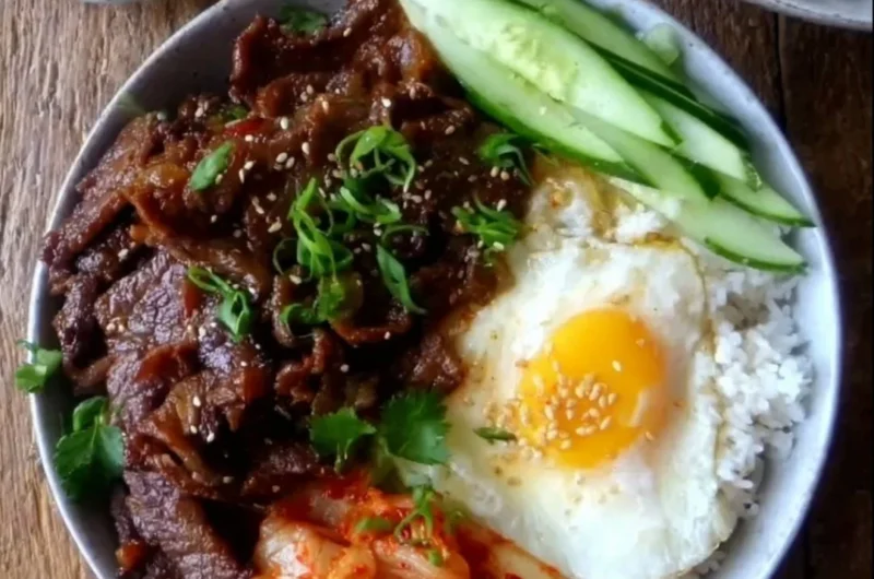 Delicious easy beef bulgogi bowl garnished with vegetables and sesame seeds