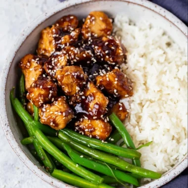Delicious plate of easy and healthy sesame chicken with vibrant vegetables