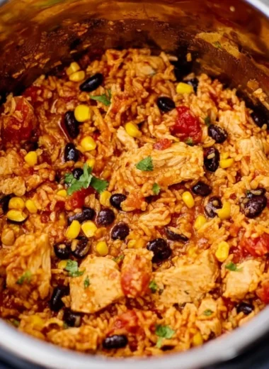 Delicious Instant Pot Chicken Burrito Bowl with chicken, rice, and toppings