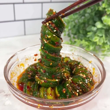 Spiral cucumber salad with Korean-inspired flavors and fresh ingredients.