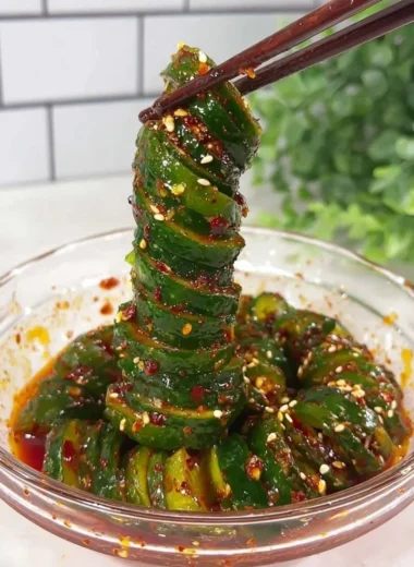 Spiral cucumber salad with Korean-inspired flavors and fresh ingredients.