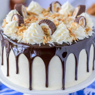 Delicious Almond Joy Layer Cake with chocolate, coconut, and almonds