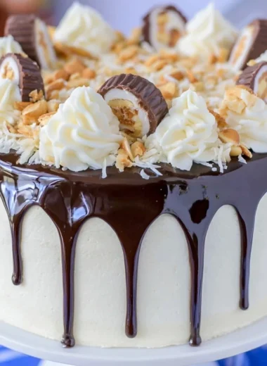 Delicious Almond Joy Layer Cake with chocolate, coconut, and almonds