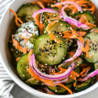 Colorful Asian cucumber salad in a bowl, ideal for Paleo, Whole30, and Keto diets