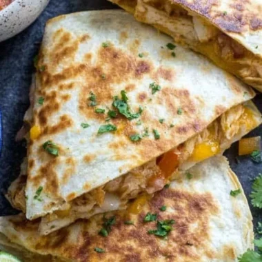 A delicious plate of chicken quesadillas filled with cheese and grilled chicken.