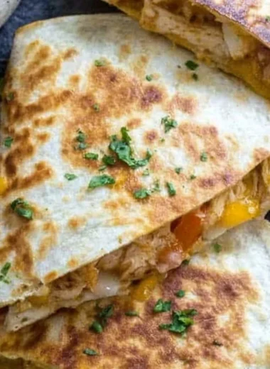 A delicious plate of chicken quesadillas filled with cheese and grilled chicken.