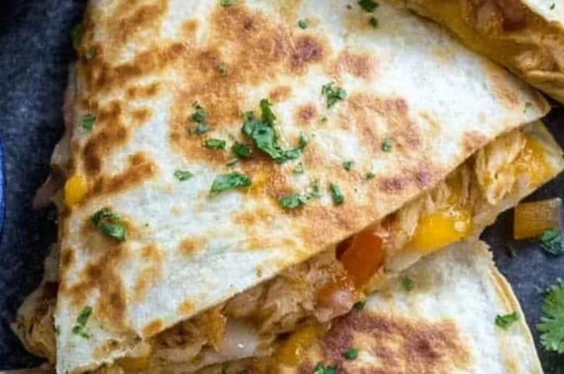 A delicious plate of chicken quesadillas filled with cheese and grilled chicken.