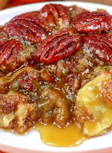 Dixie's Pecan Pie Cobbler served in a dish, featuring pecans and a golden crust.