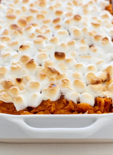 Delicious easy sweet potato casserole topped with marshmallows and nuts