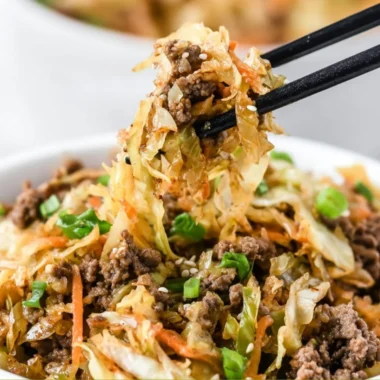 Delicious egg roll in a bowl with fresh vegetables and pork