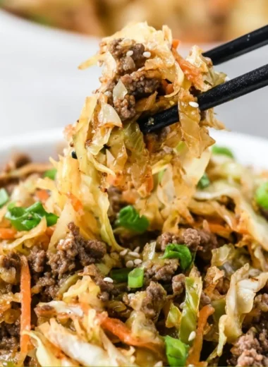 Delicious egg roll in a bowl with fresh vegetables and pork