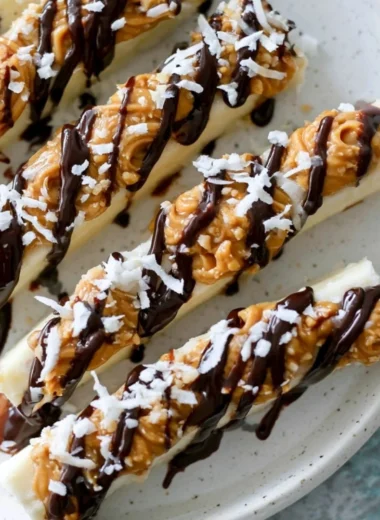 Delicious frozen banana snacks served in a bowl with toppings.