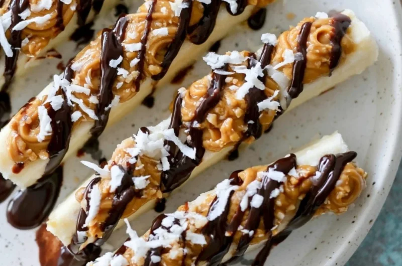 Delicious frozen banana snacks served in a bowl with toppings.