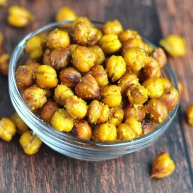 Bowl of honey mustard roasted chickpeas, a healthy snack option.