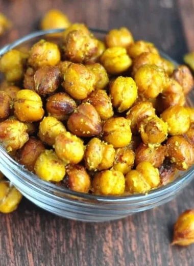 Bowl of honey mustard roasted chickpeas, a healthy snack option.