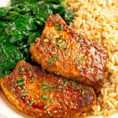 Juicy oven baked pork chops with rice, a delicious and easy recipe.