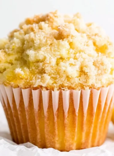 Freshly baked lemon muffins with a crunchy streusel topping