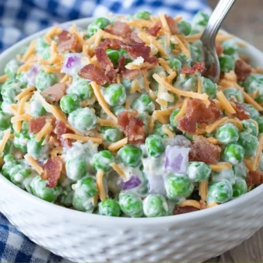 Old Fashioned Pea Salad served in a bowl with colorful ingredients