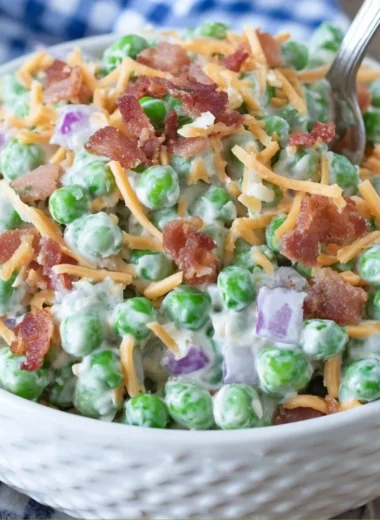 Old Fashioned Pea Salad served in a bowl with colorful ingredients