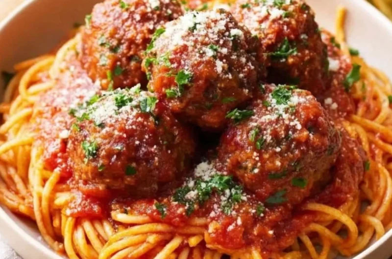 Oven-Baked Italian Meatballs served with sauce and pasta