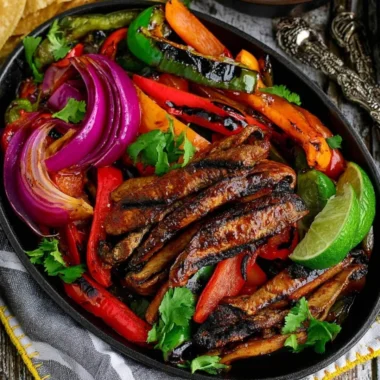 Delicious Portobello vegan fajitas served on a plate with colorful vegetables.