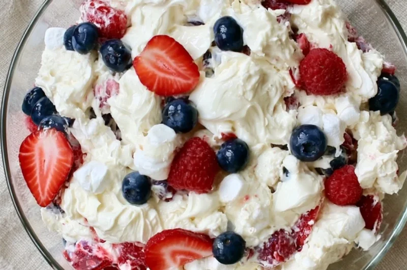 Delicious Red White and Blue Cheesecake Salad with berries and cream cheese