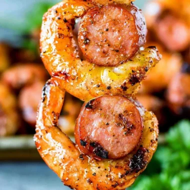 Delicious Sausage & Shrimp Kabobs on skewers, perfect for grilling.