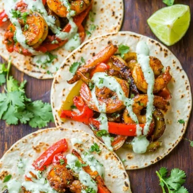 Delicious shrimp fajitas served on a plate with peppers and onions