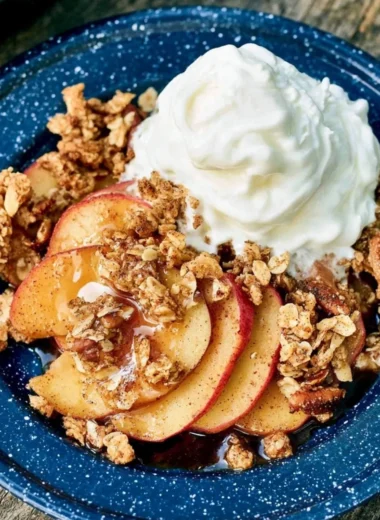 Vegan Campfire Apple Crisp dessert served outdoors