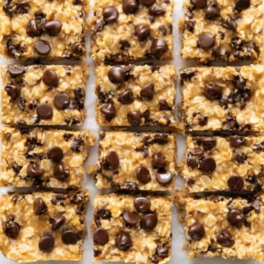 4 Ingredient No Bake Peanut Butter Oatmeal Bars on a plate with a bite taken out