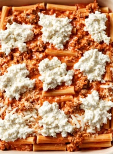 Delicious homemade Baked Ziti with melted cheese and pasta in a casserole dish.