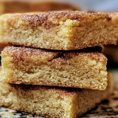 Delicious chewy snickerdoodle cookie bars with cinnamon sugar topping