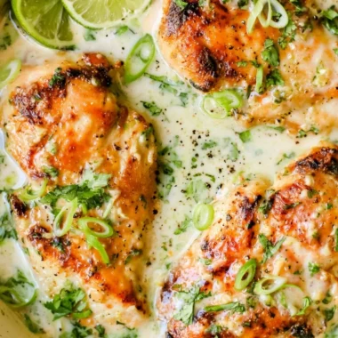 Delicious Coconut Lime Chicken garnished with lime slices and cilantro
