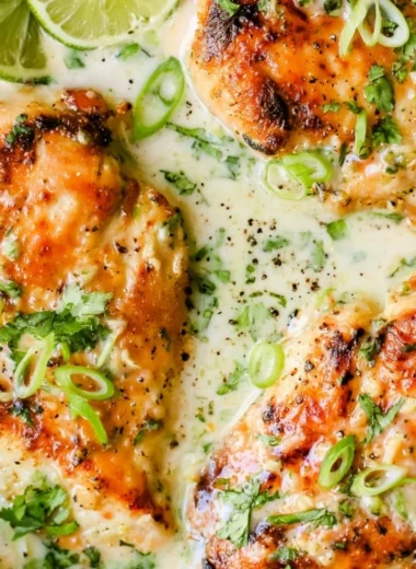 Delicious Coconut Lime Chicken garnished with lime slices and cilantro