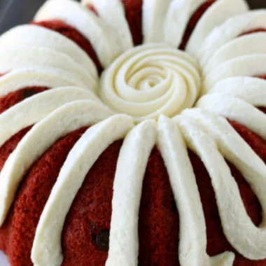 Deliciously layered Copycat Nothing Bundt Red Velvet Cake with cream cheese frosting