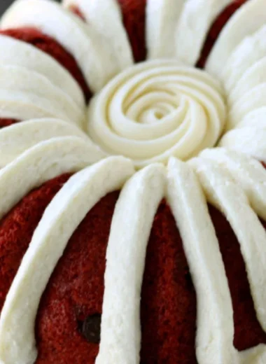 Deliciously layered Copycat Nothing Bundt Red Velvet Cake with cream cheese frosting