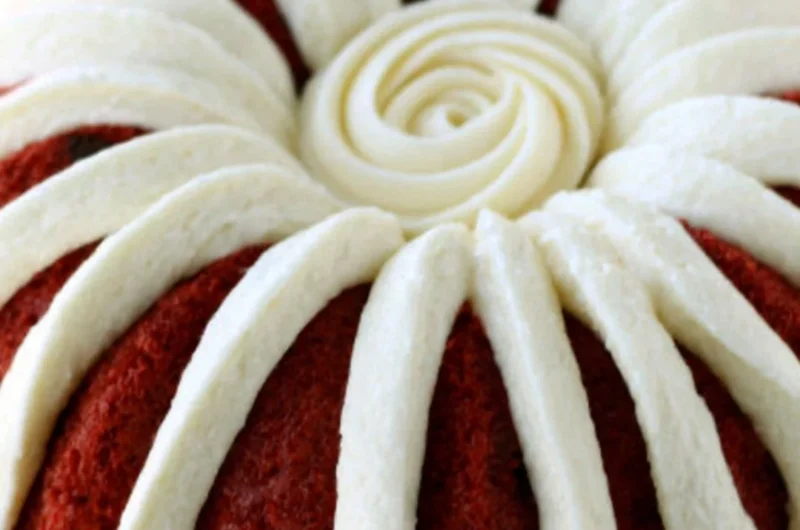 Deliciously layered Copycat Nothing Bundt Red Velvet Cake with cream cheese frosting
