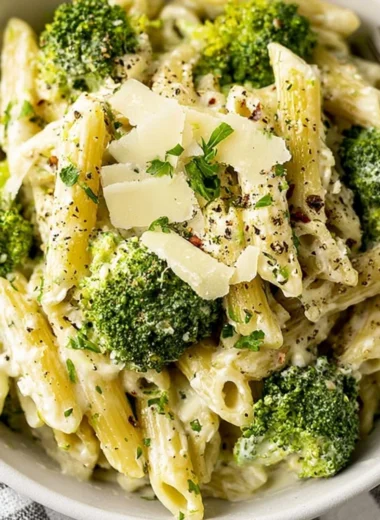 Creamy garlic pasta with broccoli served in a white bowl