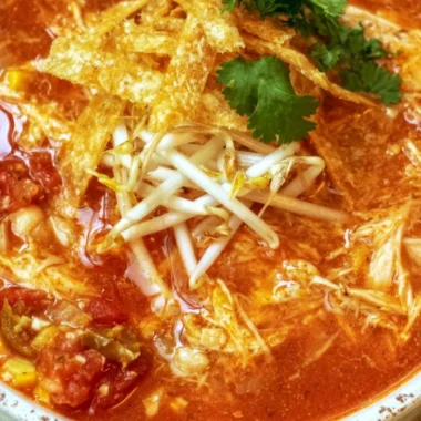 Delicious Crock Pot Chicken Tortilla Soup served in a bowl with crispy tortilla strips.