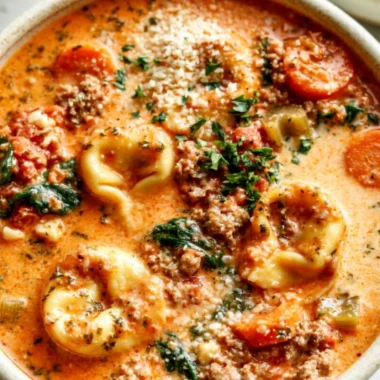 Delicious bowl of Crockpot Tortellini Soup with fresh ingredients.