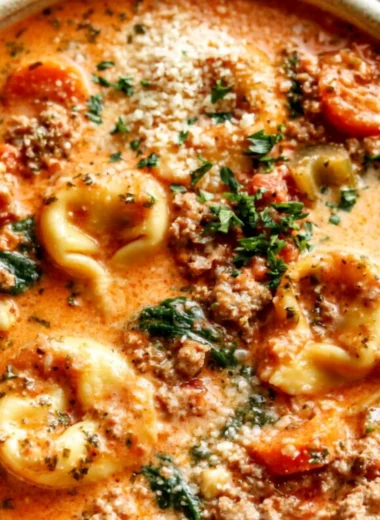 Delicious bowl of Crockpot Tortellini Soup with fresh ingredients.
