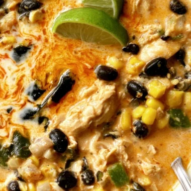 Bowl of easy chicken, poblano, and black bean soup topped with herbs