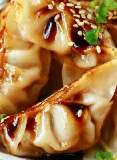 Delicious homemade easy chicken potstickers served with dipping sauce