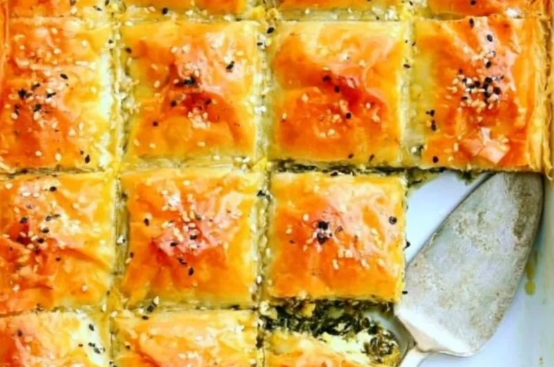 Delicious easy spinach pie with flaky crust and fresh ingredients.