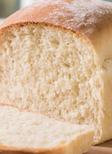 Freshly baked farmhouse sourdough loaf with a golden crust and artisanal texture.