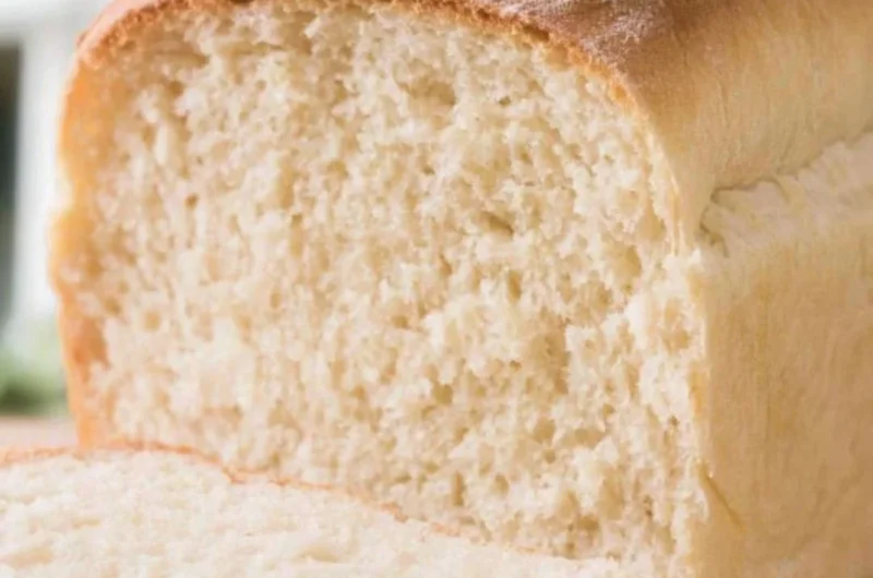Freshly baked farmhouse sourdough loaf with a golden crust and artisanal texture.